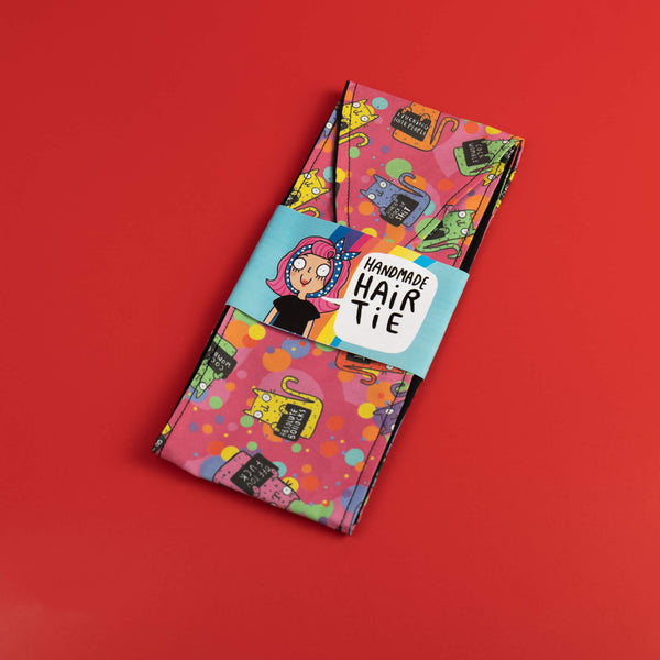 Handmade Reversible hair tie for vintage hairstyle, featuring illustrated cats on pink fabric. Designed by Katie Abey X Dawny's Sewing Room in the UK