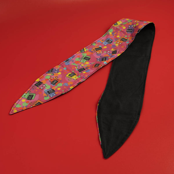 Handmade Reversible hair tie for vintage hairstyle, featuring illustrated cats on pink fabric. Designed by Katie Abey X Dawny's Sewing Room in the UK