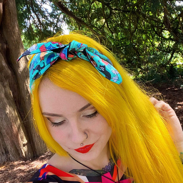 Handmade Reversible hair tie for vintage hairstyle, featuring illustrated cats on light blue fabric. Designed by Katie Abey X Dawny's Sewing Room in the UK