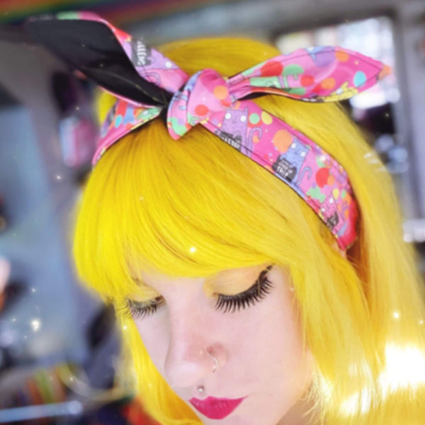 Handmade Reversible hair tie for vintage hairstyle, featuring illustrated cats on pink fabric. Designed by Katie Abey X Dawny's Sewing Room in the UK