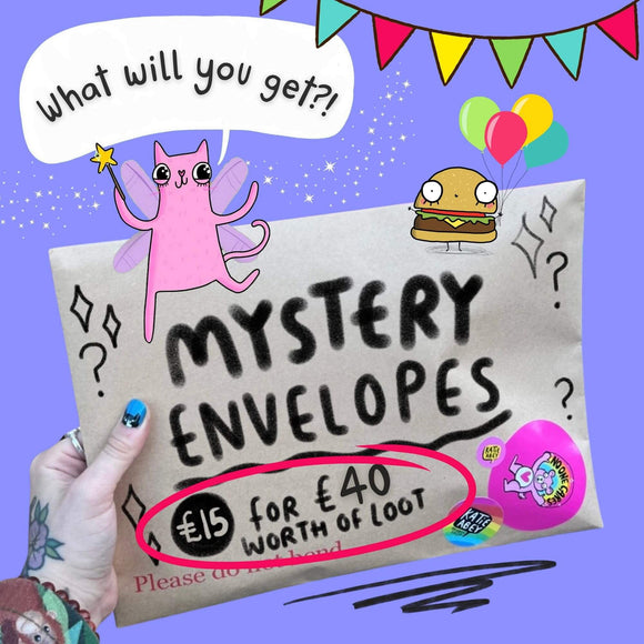 A colourful image showing a hand holding a brown envelope labelled “Mystery Envelopes £15 for £40 worth of loot,” decorated with Katie Abey’s doodles including a pink fairy cat, a burger with balloons, bunting, and sparkles. Stickers with Katie Abey's branding are on the envelope, with a fun purple background.