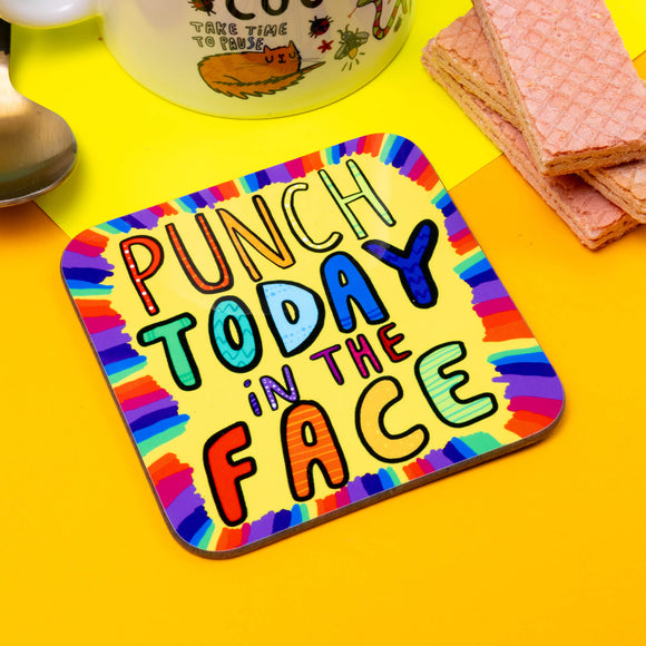 MULTI COLOURED coaster with Punch today IN THE FACE written on the front in bubble text by Katie Abey