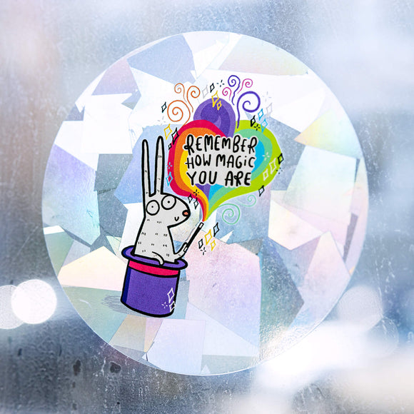 A see through sticker with a bunny in the middle coming out of a top hat Illustrated by Katie Abey text says remember how magic you are