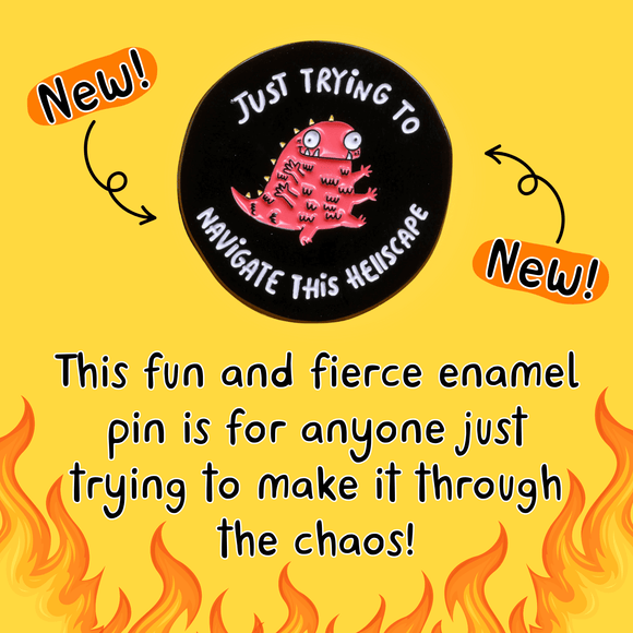 Katie Abey enamel pin featuring a quirky red creature with multiple eyes and limbs, surrounded by the text 'Just Trying to Navigate This Hellscape' on a black circular background. The pin is placed on a dark background with a hint of yellow in the corner.