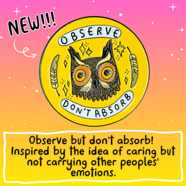 The Observe Don't Absorb Enamel Pin Badge on a yellow and teal card background. The yellow base circle soft enamel pin has a brown smiley owl with big eyes surrounded by sparkles and two feathers with text in white banners reading 'observe don't absorb'.