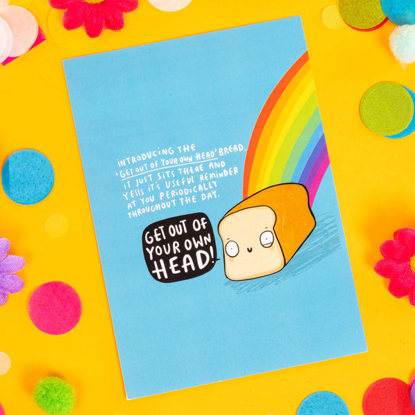 Fun A6 silk finish greeting motivational 'Get out of your own head!' postcard, featuring an illustrated happy loaf of bread with a rainbow, on a blue background and white letters that read 'introducing the get out of your own head bread. it just sits there and yells it's useful reminder at you periodically throughout the day'. Designed by Katie Abey in the UK.