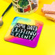 A coaster designed and illustrated by Katie Abey with rainbow background and text saying, 'some days, existing is plenty'
