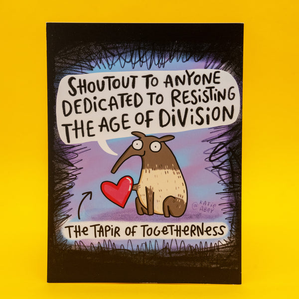 The Tapir Of Togetherness A6 postcard by Katie Abey featuring a cute illustrated tapir holding a red heart with the quote “Shoutout to anyone dedicated to resisting the age of division”. Colourful, quirky art print postcard by UK illustrator encouraging kindness, unity and embracing your weirdness. Ideal gift, wall art or positive affirmation card.
