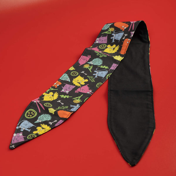 Handmade Reversible hair tie for vintage hairstyle, featuring illustrated small pets on black fabric. Designed by Katie Abey X Dawny's Sewing Room in the UK