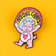 Katie Abey’s "No-One Cares Bear" pin features a pink glitter bear with tired eyes and a heart on its belly, holding a rainbow banner that reads "No-One Cares." The bear is set against a bright yellow background, highlighting its quirky design. This soft enamel pin represents Katie Abey’s signature weird, sassy style. Perfect for pin collectors or as a cheeky gift, it adds a playful and humorous touch to any accessory. Katie Abey's designs encourage embracing individuality and weirdness.