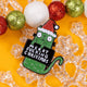 A fun and sassy Christmas enamel pin by Katie Abey featuring a green cat with bulging eyes and a Santa hat. The pin reads "Merry F***ing Christmas," and is surrounded by red, green, and white glittery baubles on a bright yellow background. Known for quirky, humorous designs, Katie Abey inspires you to celebrate your weird side this festive season. This pin is an ideal gift or a quirky addition to your holiday outfit.