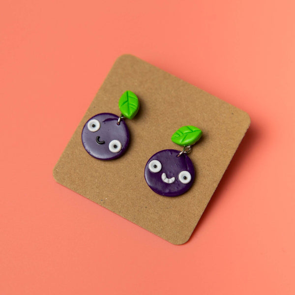 Handmade Smiley purple Plum Earrings made from resin in the UK by Katie Abey X Little Acorn Designs.
