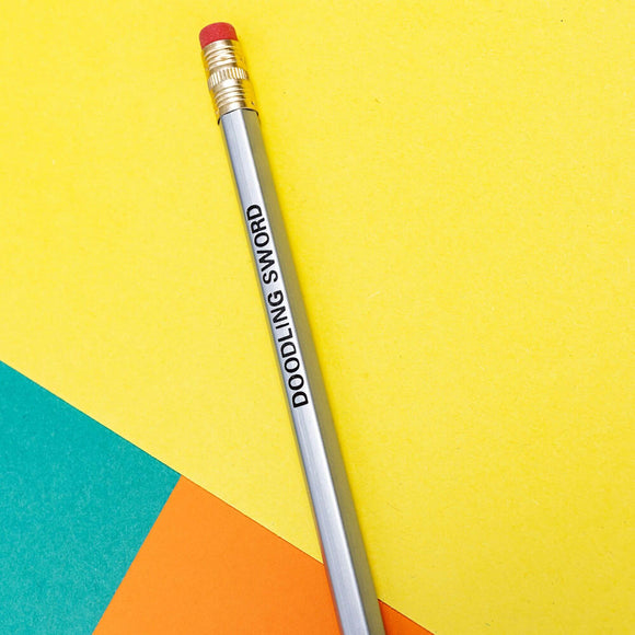 silver pencil with text saying doodling sword