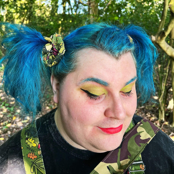 Mushroom Boi's Hair Scrunchie for hair, with illustrated green earthy mushroom design. Designed in the UK by Katie Abey