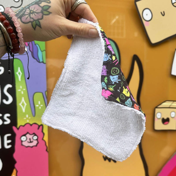 Photo showing back of the reusable large makeup wipe, which is white.