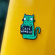 Swear Word Green and Black Cat Fridge Magnet holding funny sign. Designed by Katie Abey in the UK