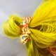 Yellow hair scrunchie with illustrated rainbows. Fun, vibrant and magical designs by Katie Abey and Dawny's Sewing Room in the UK.