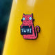 Swear Word Red and Black Cat Fridge Magnet holding funny sign. Designed by Katie Abey in the UK