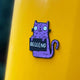 Swear Word Purple and Black Cat Fridge Magnet holding funny sign. Designed by Katie Abey in the UK