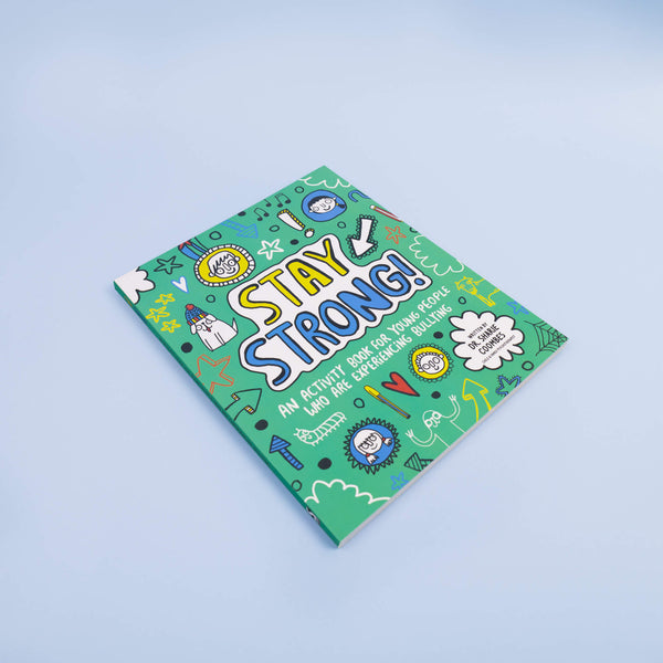 Stay Strong Book a collaboration with illustrations by Katie Abey and written by Dr. Sharie Coombes, Child & Family Psychotherapist with an introduction and notes for grown-ups. The book cover is a teal colour with various faces, symbols, animals, stars and stationary doodles bordering centre text that reads 'Stay Strong! An activity book for young people who are experiencing bullying'. The book is laying flat on a pale blue background.