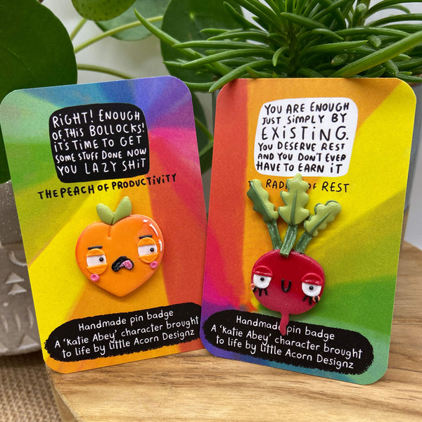Handmade Resin Peach and Radish Pin Badge Set Duo. Orange peach of productivity tells you tom 'get some stuff done' and red radish of rest tells you that 'you are enough and you deserve rest'. Designed by Katie Abey X Little Acorn Designs in the UK.