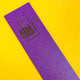 purple top of a leather bookmark with an embossed cat illustration holding a sign saying bellend