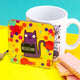 a coaster of a purple cat on a yellow confetti spotty background smiling holding a sign saying 'BELLEND'a coaster of a purple cat on a yellow confetti spotty background smiling holding a sign saying 'BELLEND'