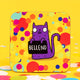 a coaster of a purple cat on a yellow confetti spotty background smiling holding a sign saying 'BELLEND'