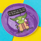 A vibrant, circular sticker featuring an illustration by Katie Abey, depicting a green alien-like character holding a pink milkshake and a walking stick. The character humorously says, "All the boys to the yard my milkshake brings" in a speech bubble. The sticker has a purple background with playful white star and diamond accents. Katie Abey is a UK-based illustrator and small business that celebrates embracing your weirdness and spreading joy through quirky designs.