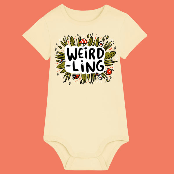Butter yellow organic cotton baby bodysuit featuring the “Weird-Ling” illustration by Katie Abey. Playful woodland design with mushrooms, leaves and fun lettering celebrating being weird and unique. Short sleeve baby grow with shoulder snaps and popper fastening for comfort and convenience.