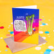 Celery of celebration A6 greeting celebration card happy smiley celery holding balloons and cake on a rainbow background. Designed by Katie Abey in the UK.