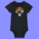 Black baby babygrow featuring Katie Abey Woke Up and Chose Violence hamster artwork with rainbow and chainsaws. Organic cotton short sleeve baby bodysuit with snap shoulder opening and popper fastenings, ideal for alternative baby clothing fans.