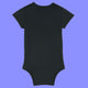 Black baby short sleeve babygrow shown from the back. Plain organic cotton baby bodysuit with a soft comfortable fit, ribbed neckline and leg openings, and popper fastenings for quick changes.