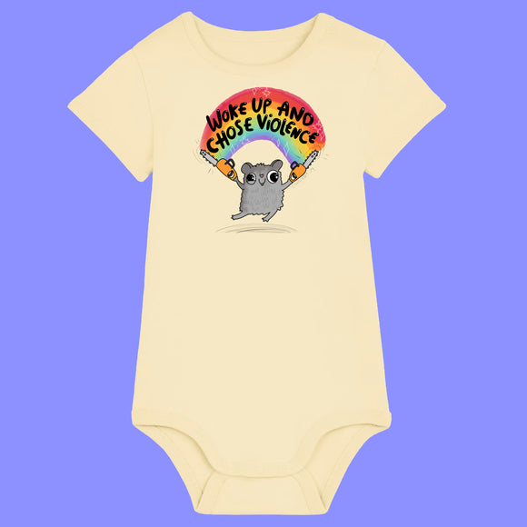 Butter yellow baby babygrow featuring Katie Abey artwork of a cute grey hamster holding chainsaws under a rainbow with the slogan Woke Up and Chose Violence. Organic cotton baby bodysuit with short sleeves, snap shoulder opening and popper fastenings.