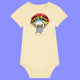 Butter yellow baby babygrow featuring Katie Abey artwork of a cute grey hamster holding chainsaws under a rainbow with the slogan Woke Up and Chose Violence. Organic cotton baby bodysuit with short sleeves, snap shoulder opening and popper fastenings.