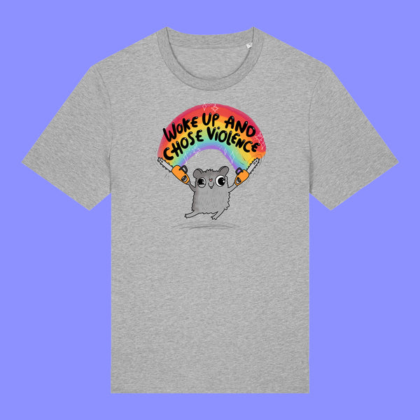 Heather grey unisex T shirt laid flat showing the front design. The Woke Up And Chose Violence Hamster Adults Tee features a cute hamster with chainsaws under a rainbow and bold slogan text by illustrator Katie Abey.