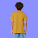 Back view of a child wearing the ochre Woke Up And Chose Violence Hamster Kids Tee by Katie Abey. Organic cotton kids t shirt with short sleeves, a relaxed fit and smooth fabric, shown from behind against a purple background.