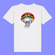 Kids white t shirt laid flat showing the front of the Woke Up And Chose Violence Hamster Kids Tee by Katie Abey. Shows a playful hamster illustration holding chainsaws under a rainbow with bold lettering on a white organic cotton tee.