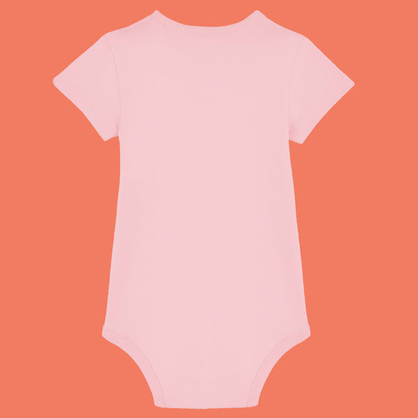 Cotton pink organic cotton baby bodysuit by Katie Abey shown from the back. Soft short sleeve babygrow with comfy interlock fabric and popper fastening for easy nappy changes. Cute unisex baby clothing designed by a small UK illustrator encouraging little ones to embrace their weirdness.
