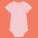 Cotton pink organic cotton baby bodysuit by Katie Abey shown from the back. Soft short sleeve babygrow with comfy interlock fabric and popper fastening for easy nappy changes. Cute unisex baby clothing designed by a small UK illustrator encouraging little ones to embrace their weirdness.
