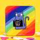 A coaster with a purple smiling cat illustration by Katie Abey holding a sign saying 'what a crock of shit' on a rainbow background.