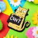 a fridge magnet of a smiley yellow cat holding a black sign with white text on that reads cunt. Designed by Katie Abey in the UK