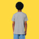 Back view of a child wearing the Cute But Feral Cat Kids T Shirt by Katie Abey in heather grey. Short sleeve organic cotton tee with a comfy unisex fit and plain back, shown against a bright yellow studio background.