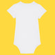 White organic cotton baby grow shown from the back with short sleeves, soft rib binding at the neckline and legs, and a popper closure at the bottom. A clean, simple design made from comfortable organic cotton for babies.
