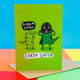 Darth Gator a6 greetings card designed and printed by Katie Abey in the UK. The card cover is neon green with two alligators, one is saying 'you are my father' and the other one is wearing a darth vador helmet and cape. The text underneath them reads 'darth 'gator'.