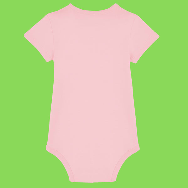 Cotton pink baby babygrow shown from the back with short sleeves and snap closure at the bottom. Soft organic cotton fabric with a smooth finish, designed for everyday comfort. Baby vest style babygrow by Katie Abey, ideal for newborns and babies.