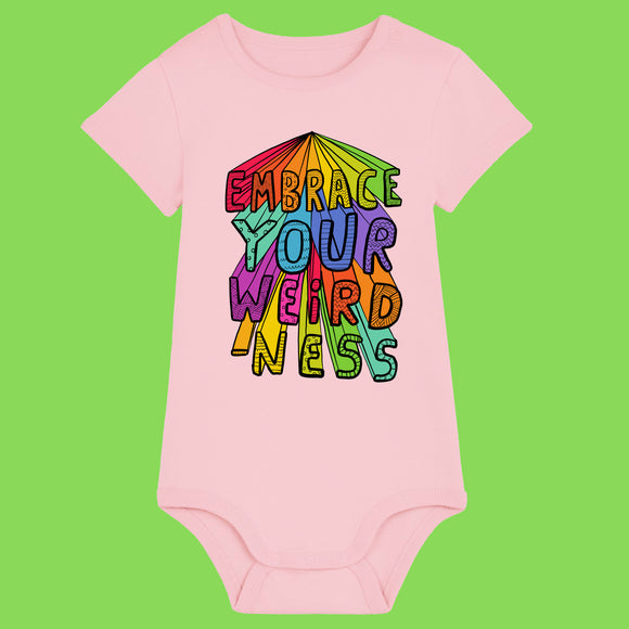 Cotton pink baby babygrow featuring Katie Abey Embrace Your Weirdness artwork in a bold rainbow design. Short sleeve baby vest with snap closures at the shoulder and bottom. Fun and inclusive baby clothing celebrating creativity, individuality and being wonderfully weird.