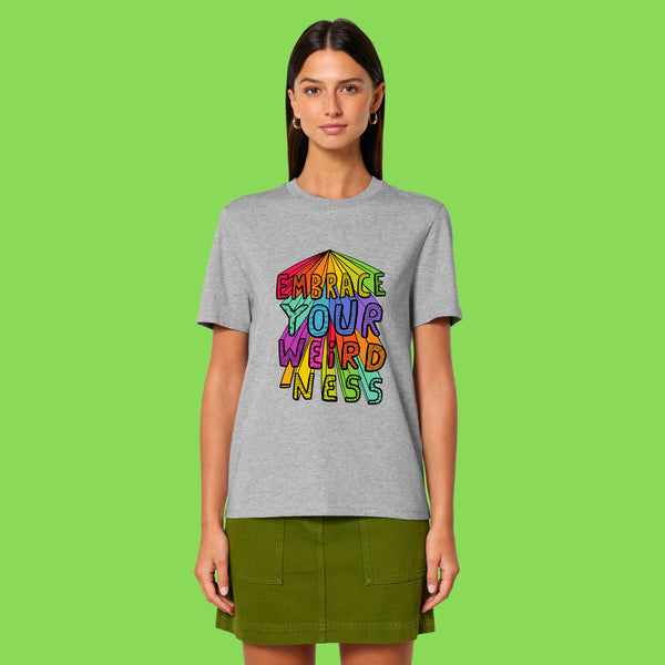 Front view of a model wearing the heather grey Embrace Your Weirdness adults t shirt. The colourful illustrated slogan is centred on the chest. Designed by Katie Abey, an illustrator who celebrates individuality and creativity.