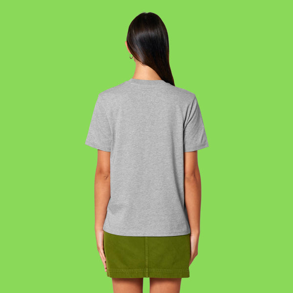 Back view of a model wearing the heather grey Embrace Your Weirdness adults t shirt. Plain back with a relaxed unisex fit, showing the length and drape of the tee.