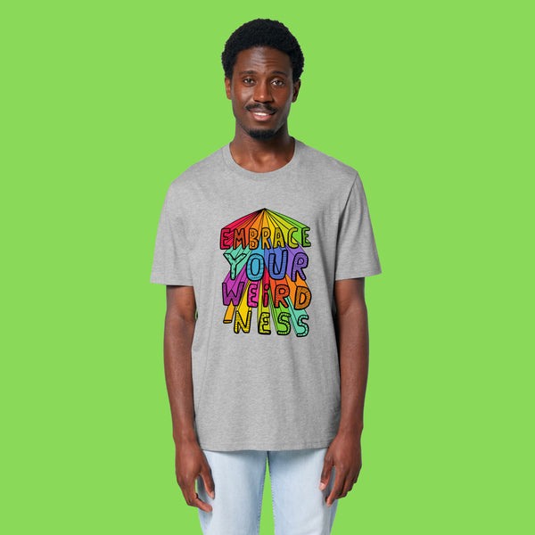 Front view of a second model wearing the heather grey Embrace Your Weirdness adults t shirt. The relaxed unisex fit and bold rainbow style illustration are clearly visible against the soft grey fabric.